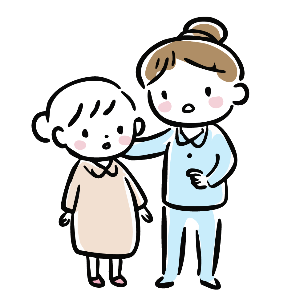 病衣を着た子どもと隣に立つ介護士
