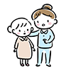 病衣を着た子どもと隣に立つ介護士