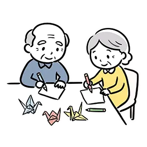 机の上で色鉛筆を使い塗り絵や折り紙の創作レクリエーションに励む高齢者の無料イラスト