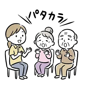 スタッフと一緒に大きく口を開けてパタカラ発声練習をする高齢者の口腔体操の無料素材